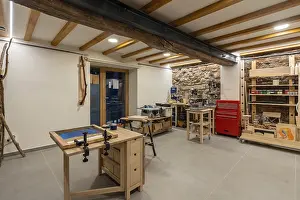 Modern Workspace Design Prints: Interior space of a screen printing studio with different tables to work