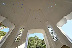 Geothermal Power Source Greece Prints: Interior of a white dome with transparent patterns and a large window opening that lets light into the interior