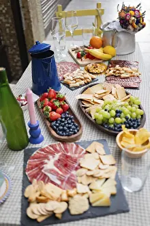 Outdoor Meal Preparation Prints: An inviting outdoor table set with assorted snacks