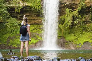 Jung Prints: Jung Woman in Front of Waterfall Print, Brazil