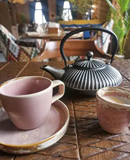 Images Dated 22nd April 2024: Kettle and Tea Cup Print on Table