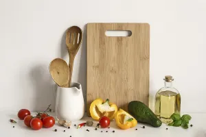 Avocado And Tomato Dish Prints: Kitchenware, vegetables and spices on table wall background