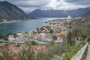 Prints of Kotor, Montenegro - April 2018 : The dome and bell tower of The Chapel of Our Lady of Salvation with Kotor Bay harbour and marina below Montenegro Prints: Kotor Bay Harbour Print - Montenegro, April 2018