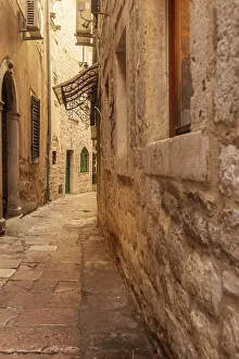 Prints of Kotor, Montenegro sunset empty narrow street of the old town with ancient stone buildings Montenegro Prints: Kotor, Montenegro Print: Sunset in Ancient Old Town Street