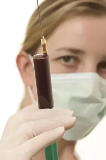 Female Doctor Portrait Prints: Lab assistant with injection