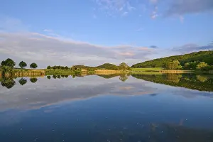 Evening Light Architecture Prints: Lake with reflection in spring with castle at sunset