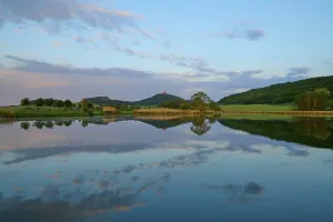 Thuringia Landscape Photography Prints: Lake with reflection in spring with castle at sunset