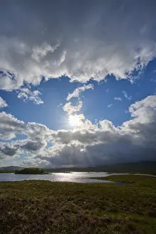 Deserted Waterfront UK Prints: Landscape with river under blue sky and dramatic clouds