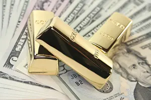 Capital Market Investments Prints: Three large gold bars on many dollar notes