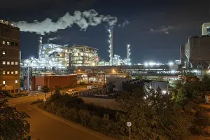Prints of Large industrial plant at night with artificial lighting and steam, surrounded by urban environment, Mannheim, Germany Mannheim Prints: Large Industrial Plant at Night Print, Mannheim, Germany