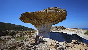 Greek Islands Landscape Prints: Large, naturally formed rock formation in the open sky