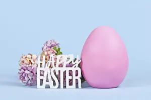 Hydrangea Flowers Prints: Large pink Easter egg, hydrangea flowers and text Happy Easter on blue background