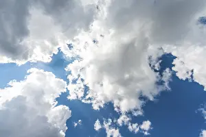 Empty Skies Photography Prints: Large white clouds against a blue sky