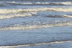 Sandy Beach Europe Prints: Leaking waves on a sandy beach