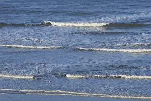 Sandy Ocean Beach Europe Prints: Leaking waves on a sandy beach
