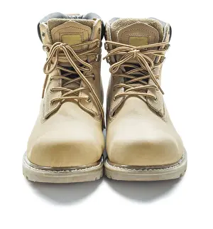 White Background Detail Prints: Leather work boots against a white background