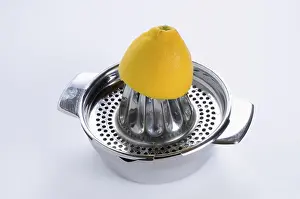 Studio Shot Of Lemon Prints: Lemon on a lemon squeezer