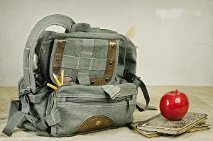 Deserted Table Setting Prints: Still life with an old backpack