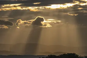 Morning Sunrise Prints: Light rays of the sun's rays through clouds in the morning