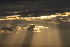 Contemplative Morning Moment Prints: Light rays of the sun's rays through clouds in the morning