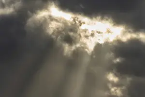 Cloudy Sky Europe Prints: Light rays of the sun's rays through clouds in the morning