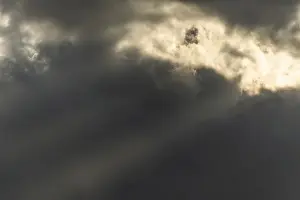 Cloudy Sky With Sun Rays Prints: Light rays of the sun's rays through clouds in the morning