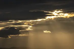 Morning Clouds Prints: Light rays of the sun's rays through clouds in the morning
