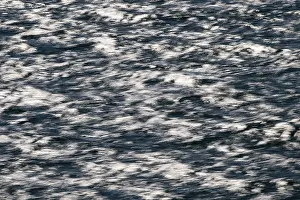 Deserted Beach Scenes Prints: Light and shadow, blurred waves on the sea