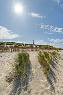 North Sea Island Landscape Prints: Lighthouse with blue sky, sun, backlight at Ellenbogen