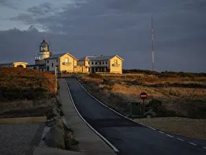 Deserted Beach At Sunset Spain Prints: Lighthouse of Estaca of Bars at sunset