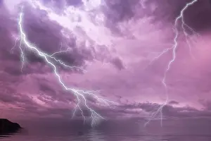 Stormy Atmosphere Europe Prints: Lightning over the sea with a dramatic sky