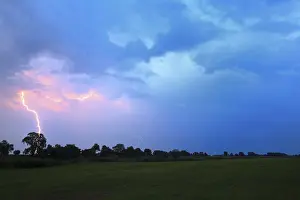 Stormy Weather Conditions Prints: Lightning striking the ground