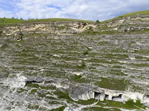 Prints of Limestone cliffs with visible cave structures, green under blue clouds, aerial view, cave dwellings, Old Orhei, Orheiul Vechi, archaeological site, protected landscape area, Orhei district Moldova Prints: Limestone Cliffs Print, Old Orhei, Moldova