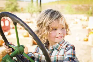 Pumpkin Patch Fun Prints: Little boy having fun in A tractor in a rustic ranch setting at the pumpkin patch