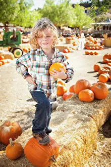 Rustic Ranch Setting Prints: Little Boy Standing in a Rustic Ranch Setting at the Pumpkin Patch