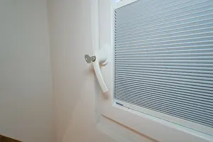 Modern European Architecture Style Prints: Detail of a lockable white window handle with integrated blind
