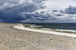Baltic Sea Island Prints: Lonely pebble beach, dramatic storm clouds