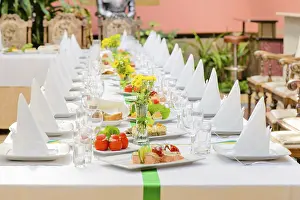 Appetizing Food Display Prints: Long served table with plates, glasses