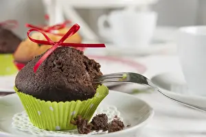 Sweet Treats On Display Prints: Lovingly decorated muffins on a coffee table