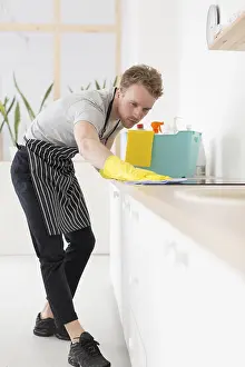 Cleanliness In Food Preparation Prints: Low angle man cleaning kitchen