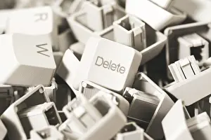 Prints of Macro view of a heap of computer keyboard keys. Focus on DELETE key. Computer repair, service Photorealistic Artwork Prints: Macro View of Keyboard Keys, Focus on DELETE Key Print