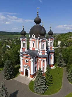 Prints of Magnificent Orthodox Cathedral with dark domes and surroundings surrounded by pine trees, aerial view, Cathedral of the Nativity of the Virgin Mary, Curchi monastery, Orhei district Moldova Prints: Magnificent Orthodox Cathedral Print, Moldova