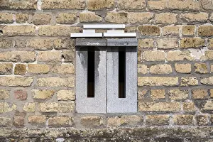 Deserted Postal Service Prints: Mailboxes integrated into a brick wall