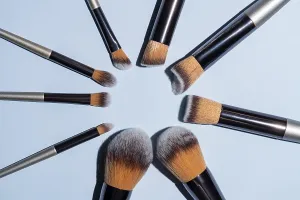 Personal Hygiene Goods Prints: Make up brush sets arranged in a circle on blue background