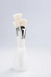 Cosmetic Brushes Prints: Make up brushes of different size and type in a glass against white background