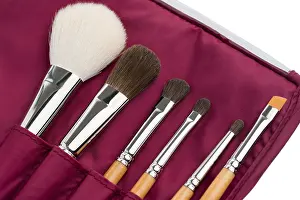 Close Up Detail Shot Prints: Make up brushes of different size and type in a vionous case object isolated shot on white