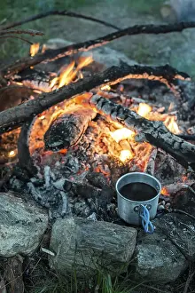Forest Scenery At Sunset Prints: Making coffee on campfire in the forest