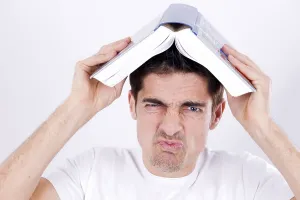 Caucasian Ethnicity Studio Portrait Prints: Man with a book on head