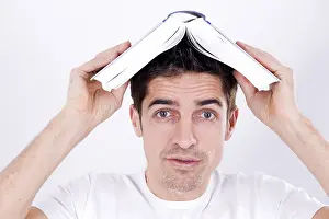 Caucasion Ethnicity Photo Shoot Prints: Man with a book on his head