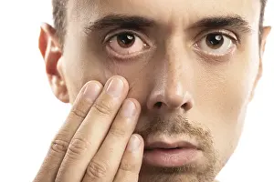 Bright White Background Photo Prints: Man checking condition of his eye on white background